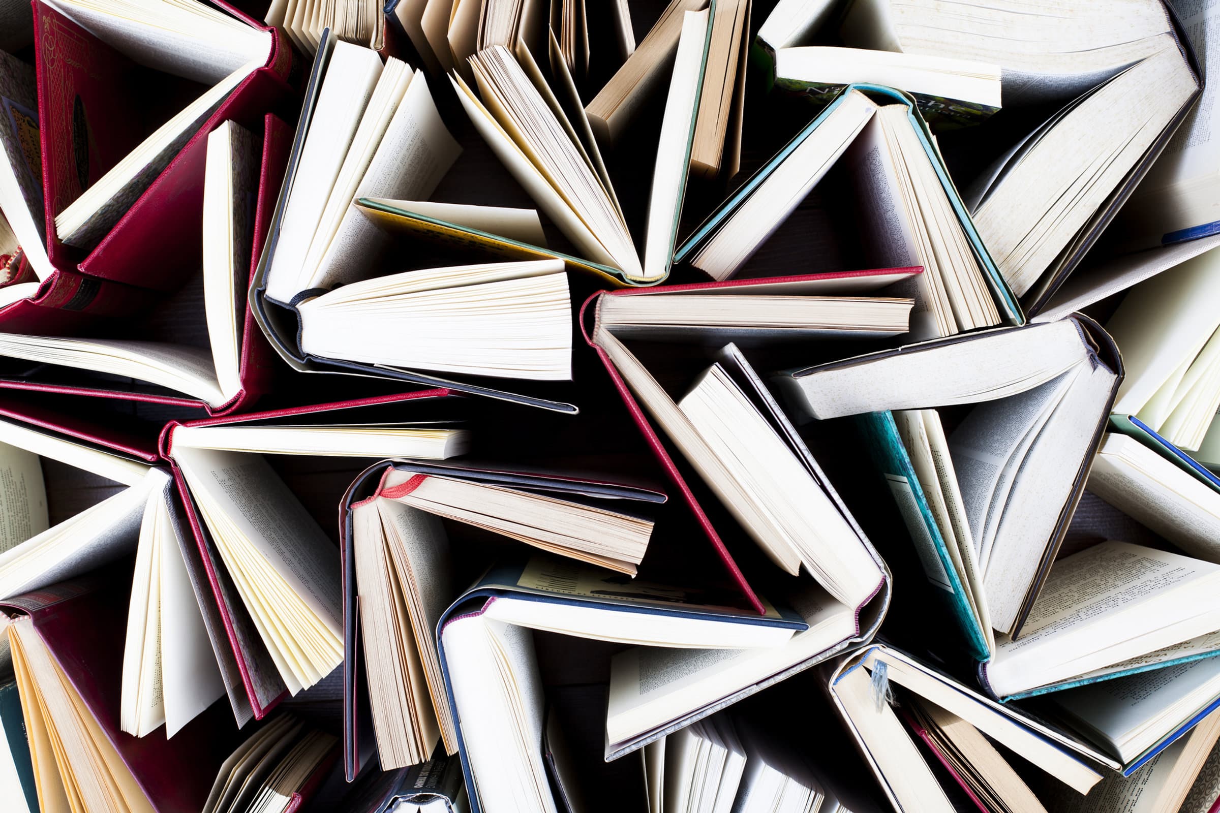 Open books fanned across a table